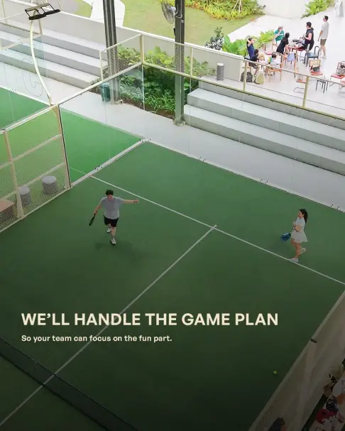 Players on court during a corporate padel event